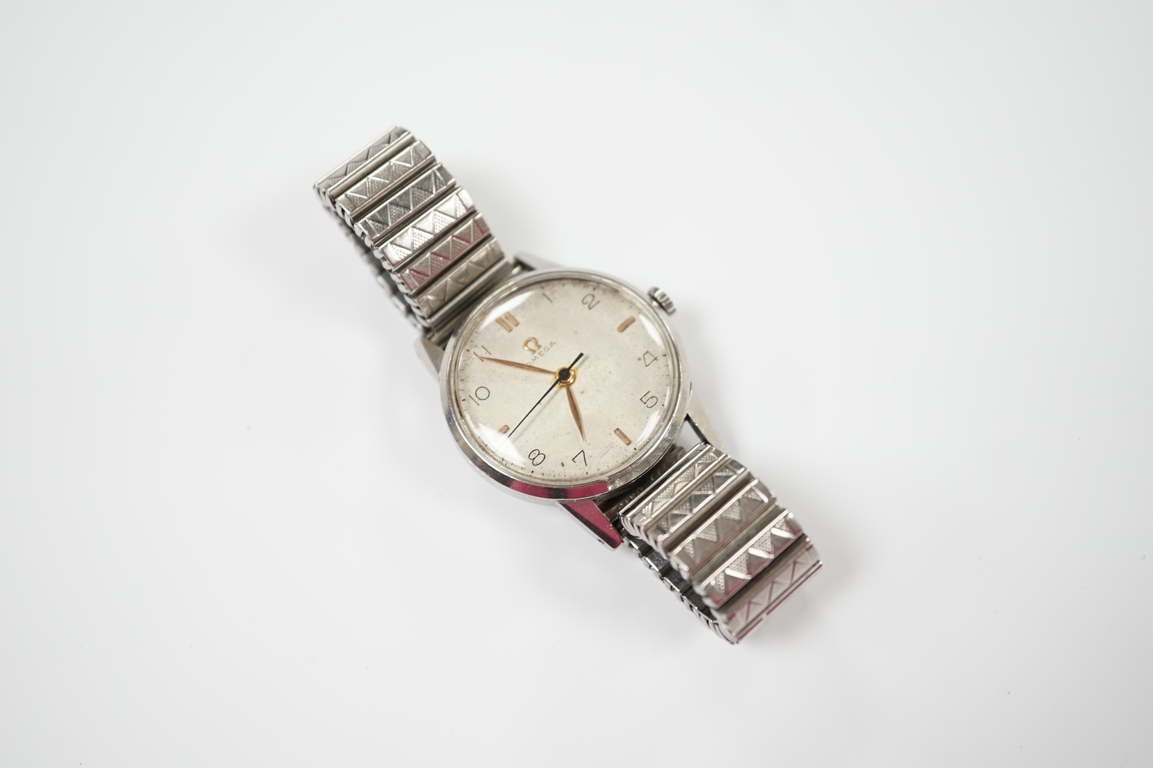 A gentleman's late 1940's stainless steel Omega manual wind wrist watch, movement c.283, on associated strap.